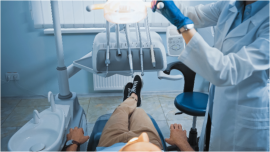 dentist performing oral exam 