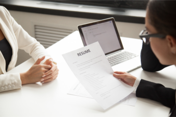 business manager reviewing resume