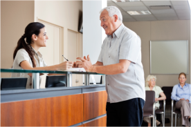 receptionist checking in patient