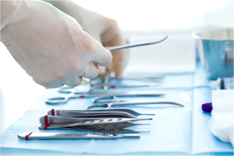 gloved hygienist sterilizing equipment  