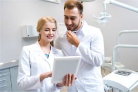 dentist and hygienist discussing a case 